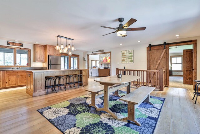 445 Elk Lake Resort Rd Unit 947-948, Owenton, KY 40359 - dining room featuring a barn door, light wood-style flooring, recessed lighting, and a ceiling fan