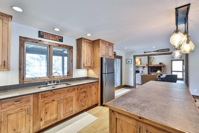 445 Elk Lake Resort Rd Unit 947-948, Owenton, KY 40359 - kitchen with freestanding refrigerator, light wood-style floors, recessed lighting, pendant lighting, and brown cabinets