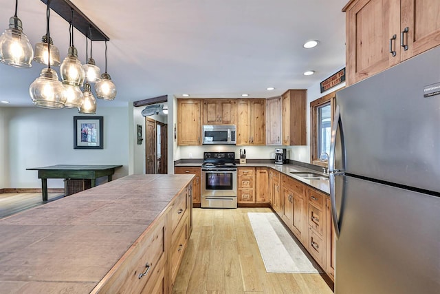 445 Elk Lake Resort Rd Unit 947-948, Owenton, KY 40359 - kitchen featuring appliances with stainless steel finishes, light wood-style floors, recessed lighting, hanging light fixtures, and tile counters