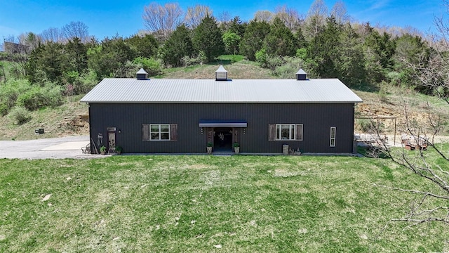 back of property with a yard