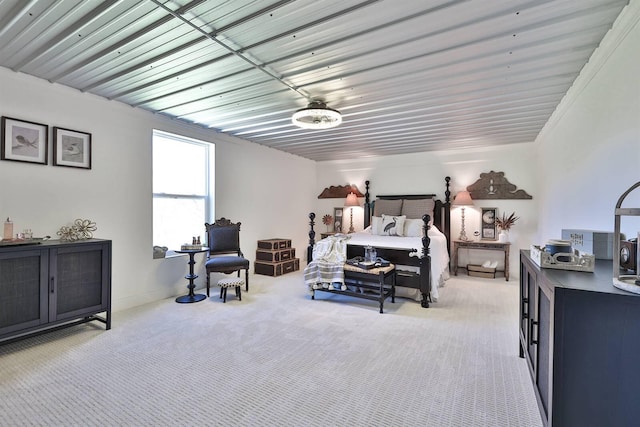 bedroom featuring light carpet
