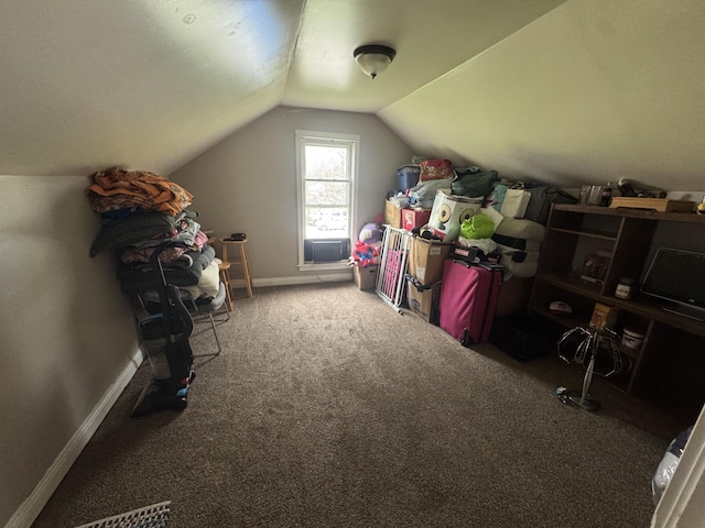 additional living space with lofted ceiling, baseboards, and carpet floors