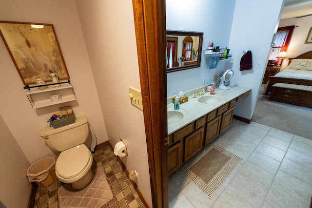 9917 E Bend Rd, Burlington, KY 41005 - ensuite bathroom featuring double vanity, toilet, and tile patterned floors