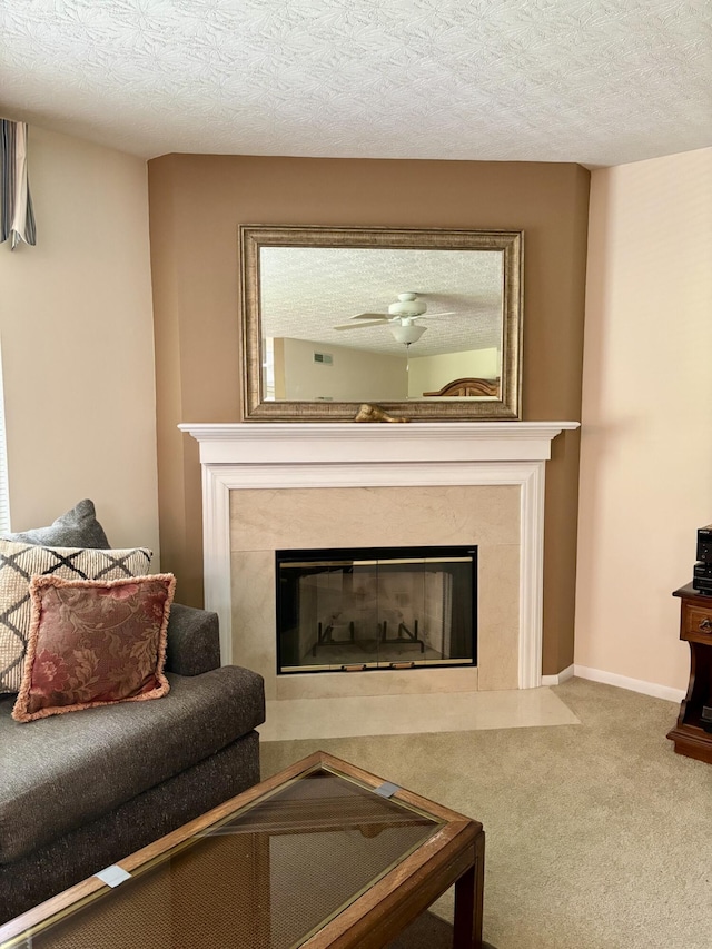 207 S Watchtower Dr Unit 203, Wilder, KY 41076 - carpeted living area featuring a fireplace and a textured ceiling