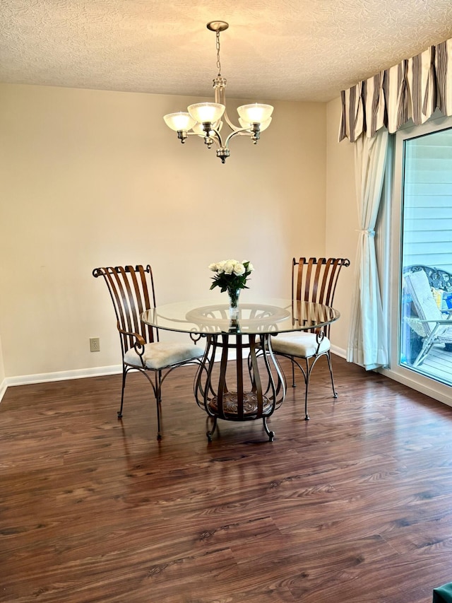 207 S Watchtower Dr Unit 203, Wilder, KY 41076 - dining area with a textured ceiling, a chandelier, dark wood finished floors, and baseboards