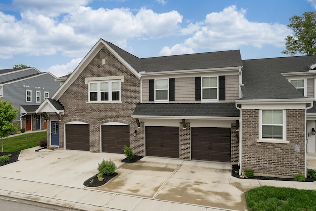 692 Daphne Way, Crescent Springs, KY 41017 - view of front of property featuring a garage, concrete driveway, brick siding, and roof with shingles