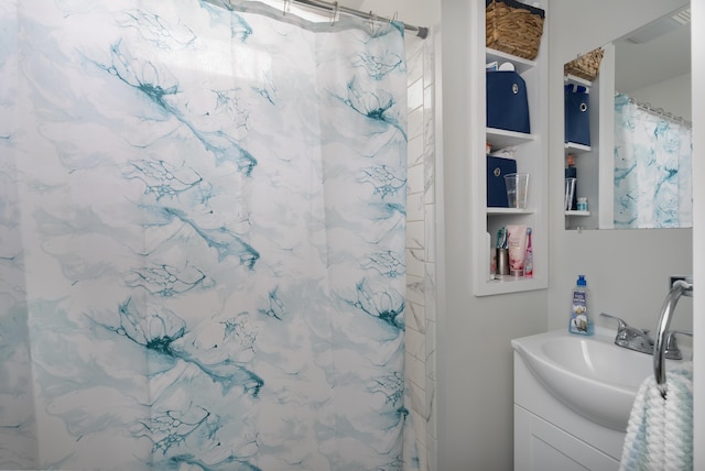 full bath with vanity and a shower with shower curtain
