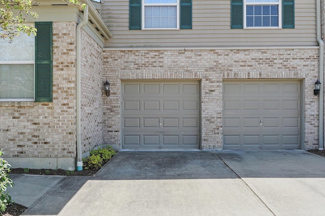 garage featuring driveway
