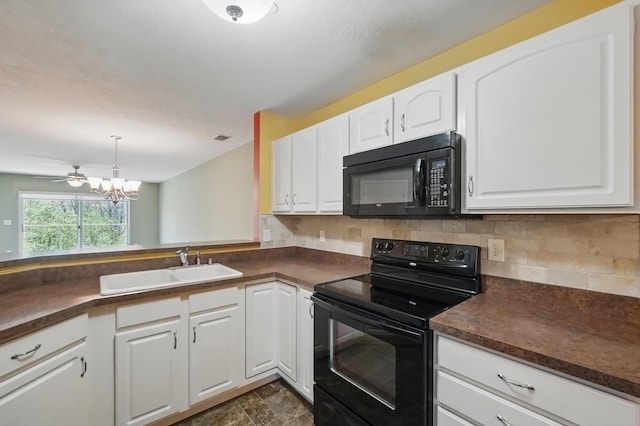 kitchen with dark countertops, a chandelier, white cabinetry, backsplash, and black appliances