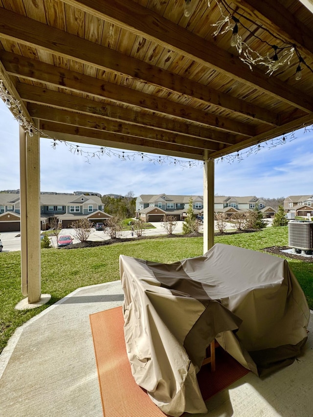 view of patio featuring a residential view and central air condition unit