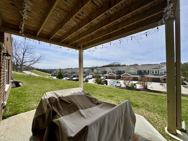 view of patio / terrace featuring grilling area and a residential view