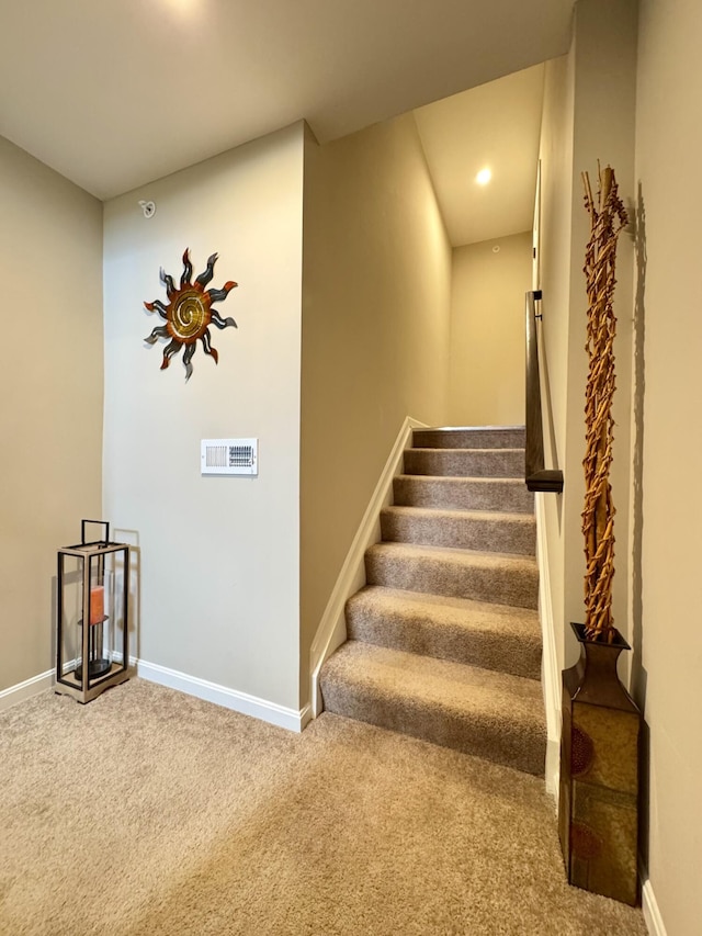 staircase with recessed lighting, carpet flooring, and baseboards