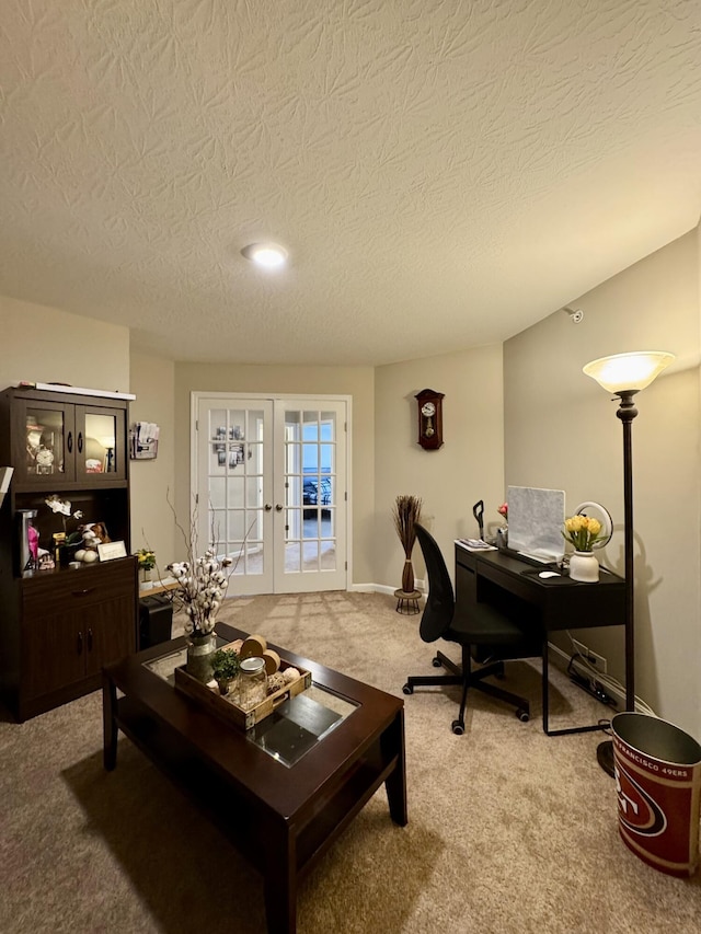 carpeted office space with french doors, baseboards, and a textured ceiling