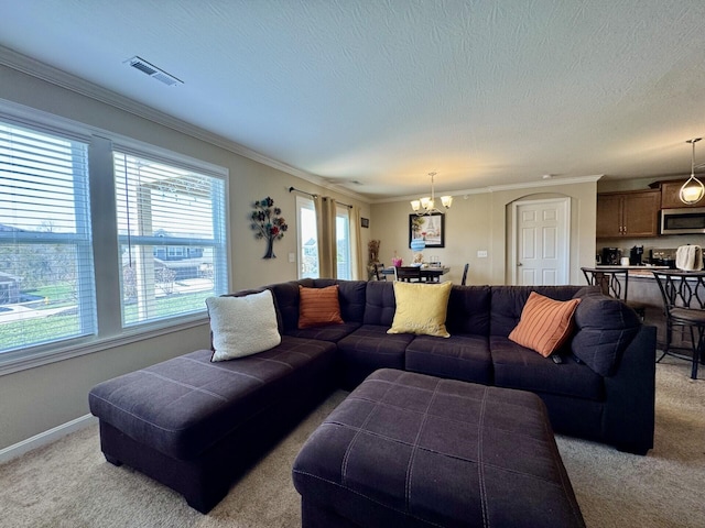 living area featuring light carpet, baseboards, visible vents, and a chandelier