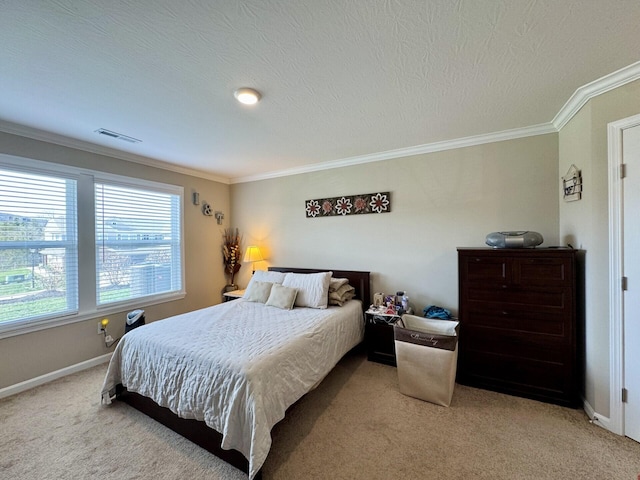 bedroom with a textured ceiling, light carpet, baseboards, ornamental molding, and visible vents