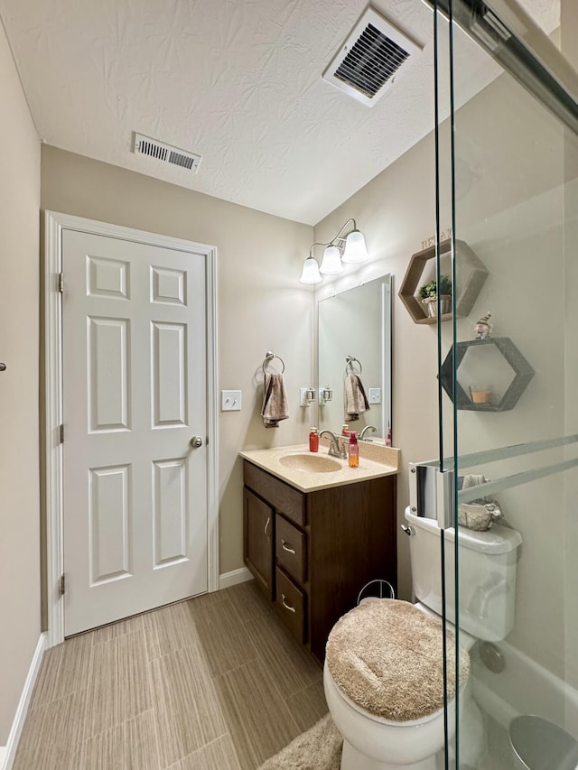 full bathroom featuring baseboards, visible vents, vanity, and toilet