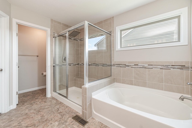 full bathroom with a garden tub, a stall shower, and visible vents