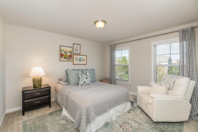 carpeted bedroom with baseboards
