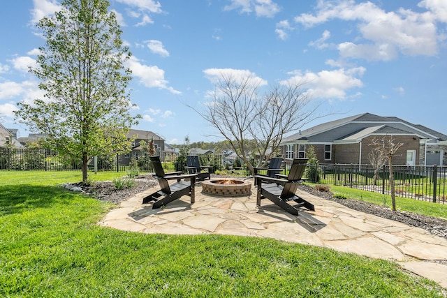 view of patio with a fire pit and fence