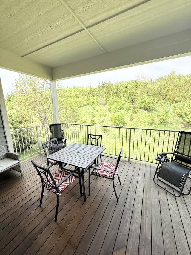 wooden deck with outdoor dining area