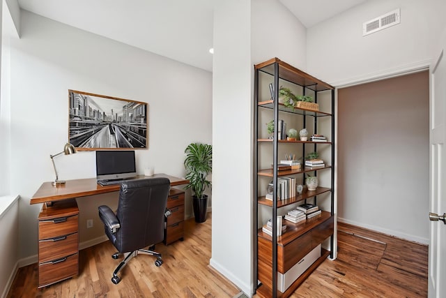 office with wood finished floors and baseboards