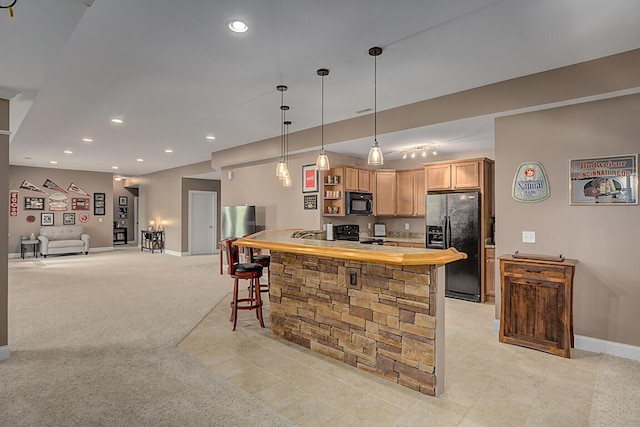 11660 Agarwood Dr, Walton, KY 41094 - kitchen featuring recessed lighting, light brown cabinetry, black appliances, and hanging light fixtures