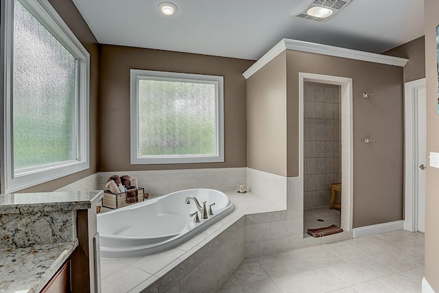 11660 Agarwood Dr, Walton, KY 41094 - full bathroom featuring a garden tub, tile patterned floors, visible vents, and a healthy amount of sunlight