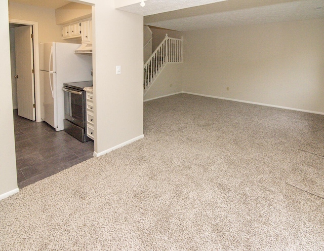 unfurnished living room with dark carpet, stairs, and baseboards