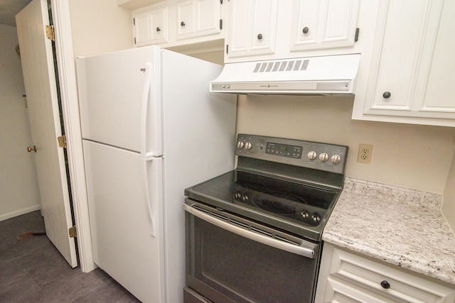 kitchen with range hood, light stone countertops, stainless steel range with electric stovetop, freestanding refrigerator, and white cabinetry