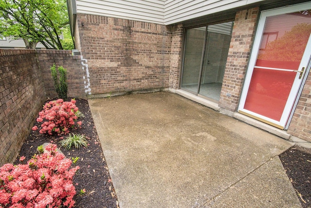 view of patio / terrace featuring fence