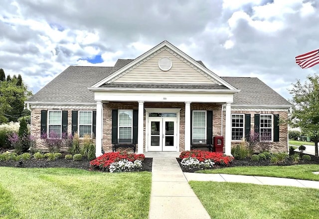 685 Radnor Ln, Walton, KY 41094 - view of front facade featuring brick siding, a front lawn, roof with shingles, and covered porch