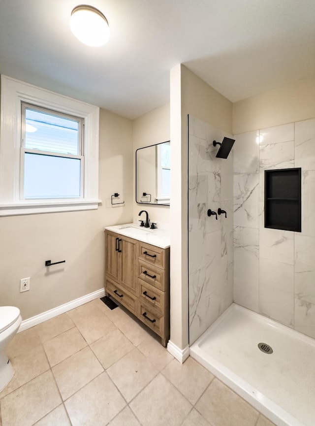 38 W 28th St, Covington, KY 41015 - full bathroom with baseboards, toilet, vanity, and tiled shower
