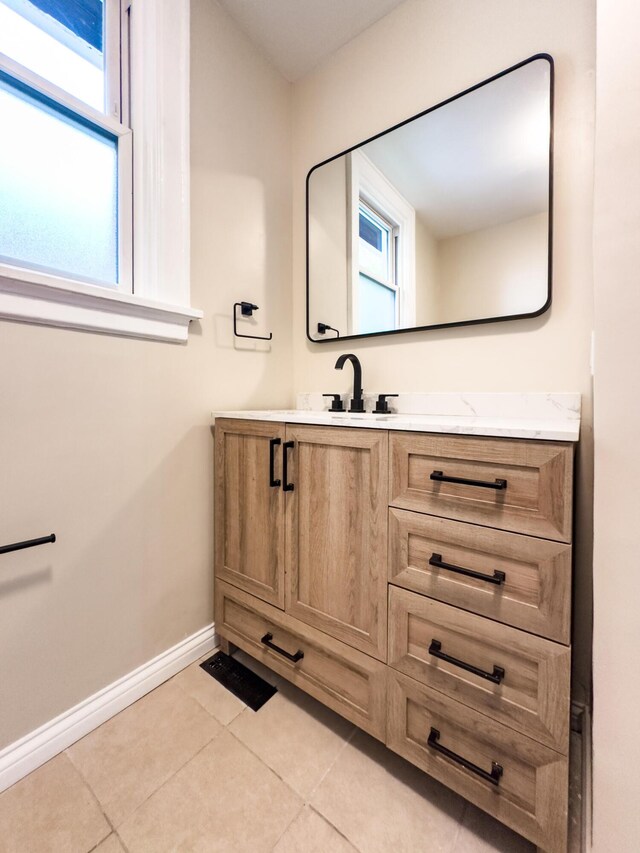 38 W 28th St, Covington, KY 41015 - bathroom featuring vanity, baseboards, and tile patterned flooring