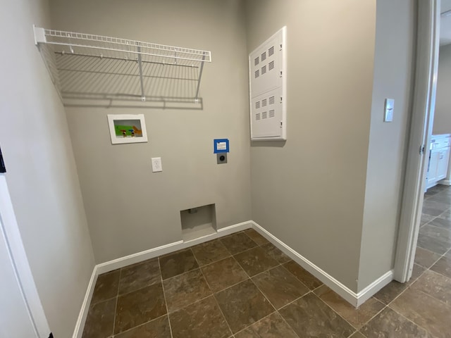 laundry area featuring laundry area, hookup for a washing machine, baseboards, and hookup for an electric dryer