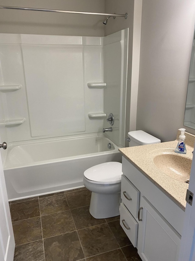 bathroom featuring bathing tub / shower combination, vanity, and toilet