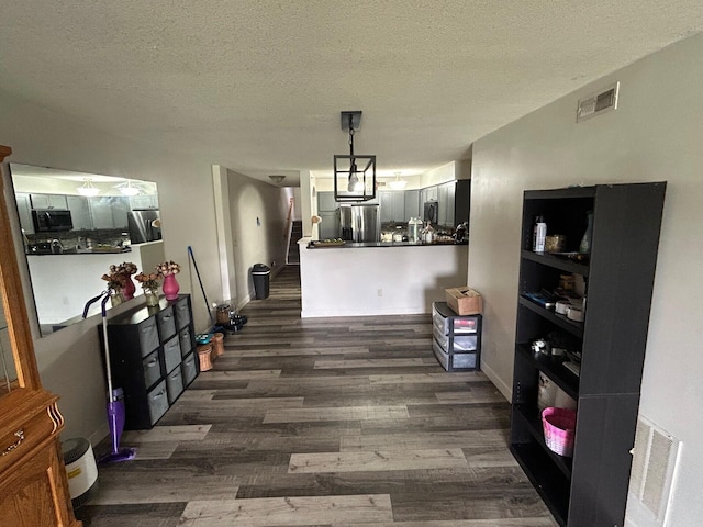 799 Slate Vw, Cold Spring, KY 41076 - dining room with dark wood-style flooring, a textured ceiling, stairs, and baseboards