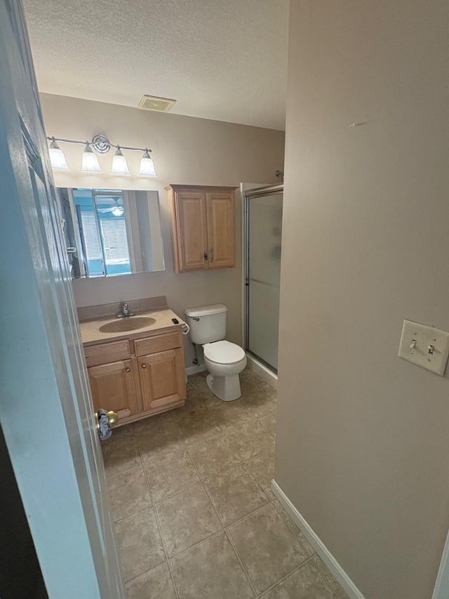 799 Slate Vw, Cold Spring, KY 41076 - bathroom with vanity, toilet, a stall shower, a textured ceiling, and tile patterned flooring