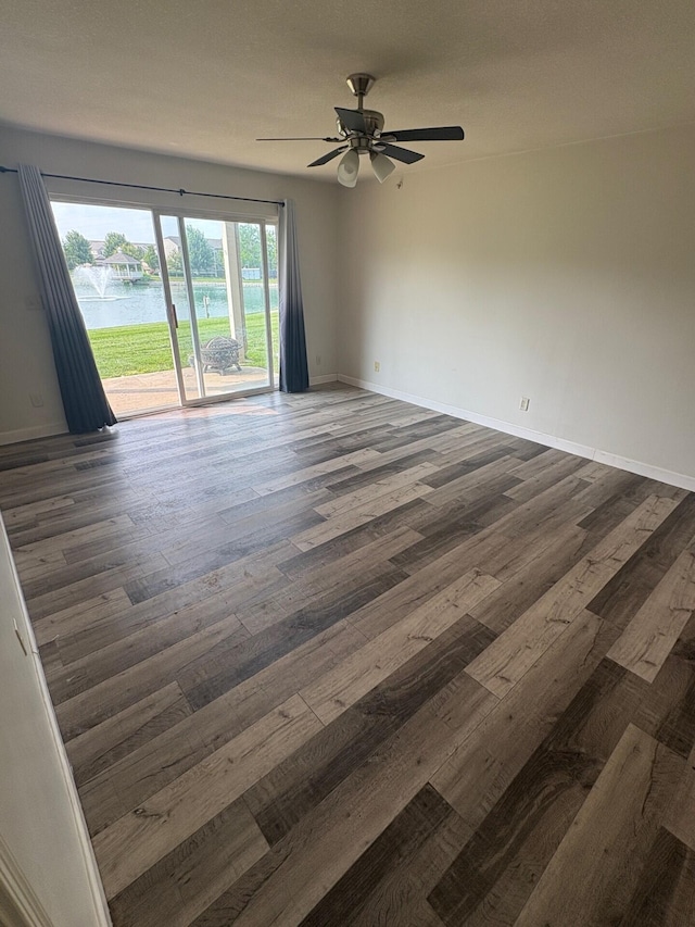 799 Slate Vw, Cold Spring, KY 41076 - empty room with dark wood-style floors, a water view, a ceiling fan, and baseboards