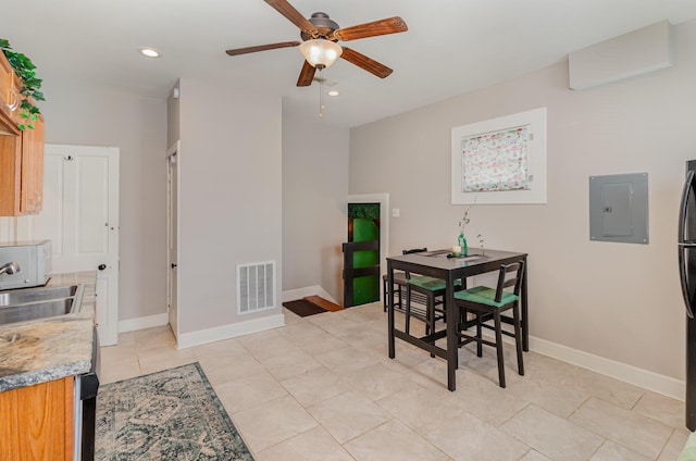 705 Bakewell St, Covington, KY 41011 - dining room with baseboards, ceiling fan, electric panel, and visible vents