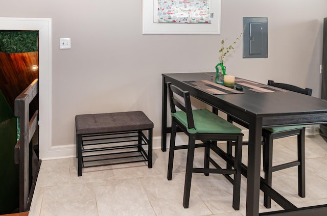 705 Bakewell St, Covington, KY 41011 - dining space featuring baseboards, light tile patterned flooring, and electric panel