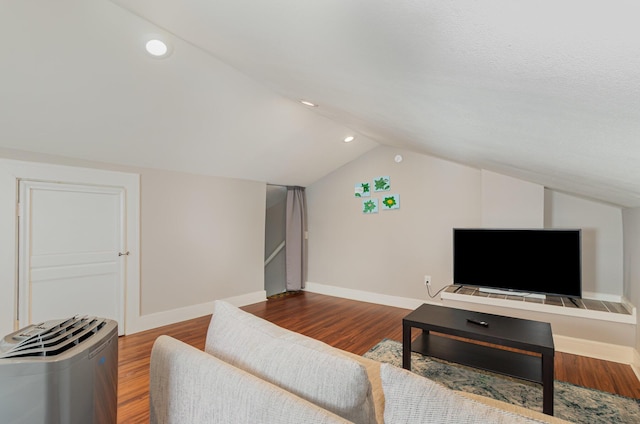 705 Bakewell St, Covington, KY 41011 - living area featuring baseboards, vaulted ceiling, and wood finished floors