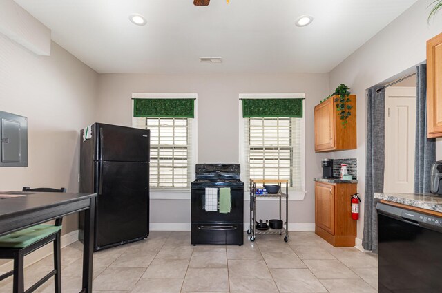 705 Bakewell St, Covington, KY 41011 - kitchen with baseboards, visible vents, black appliances, and electric panel