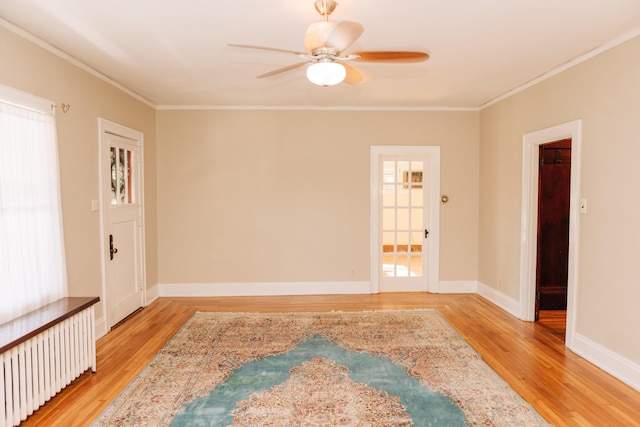 2225 Oakland Ave, Covington, KY 41015 - spare room with radiator, ornamental molding, ceiling fan, and light wood-type flooring