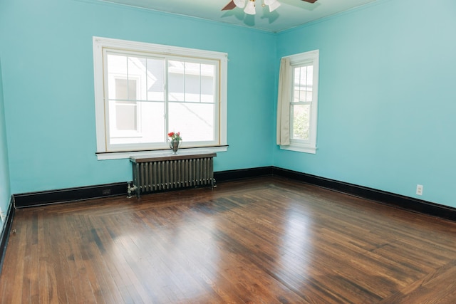 2225 Oakland Ave, Covington, KY 41015 - unfurnished room featuring radiator, wood finished floors, crown molding, and ceiling fan