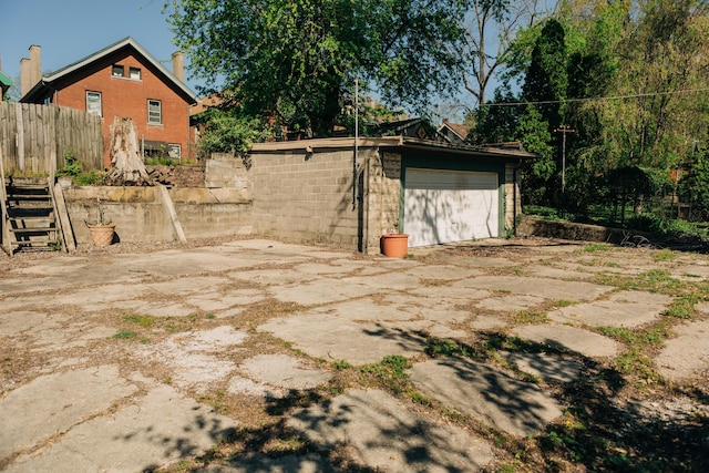 2225 Oakland Ave, Covington, KY 41015 - exterior space featuring a chimney, fence, driveway, an outbuilding, and brick siding