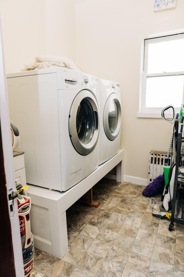 2225 Oakland Ave, Covington, KY 41015 - clothes washing area with baseboards, independent washer and dryer, laundry area, and radiator