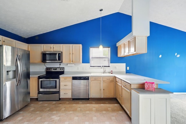 kitchen with stainless steel appliances, a sink, light brown cabinets, light countertops, and a peninsula