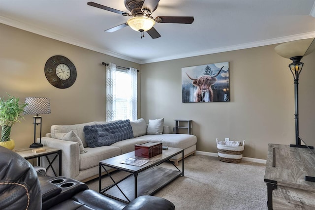 carpeted living area featuring ceiling fan, ornamental molding, and baseboards