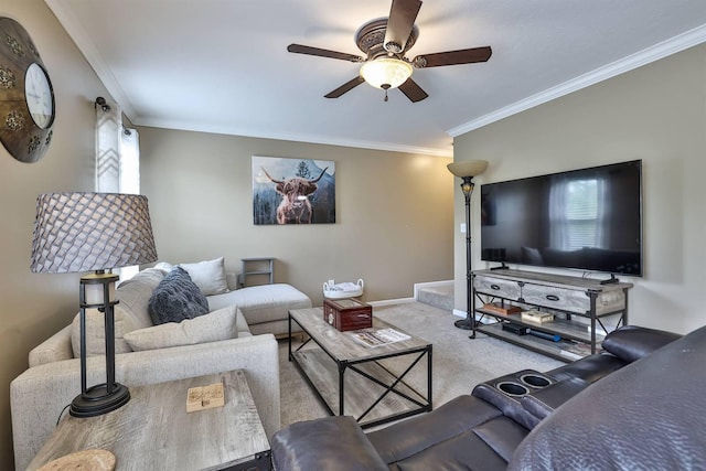 living room featuring crown molding, carpet flooring, a healthy amount of sunlight, baseboards, and a ceiling fan