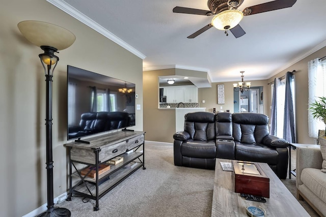 living area featuring crown molding, baseboards, ceiling fan with notable chandelier, and light colored carpet